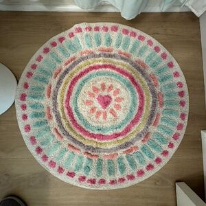 Pottery Barn Kids Heart Dot Round Bath Mat, 28" in diameter.